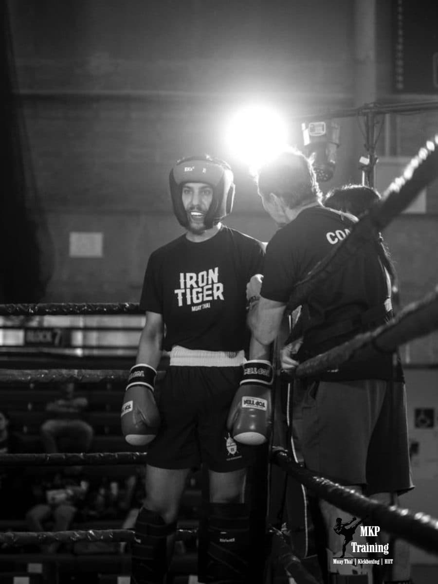 Body kick landing during a sparring round